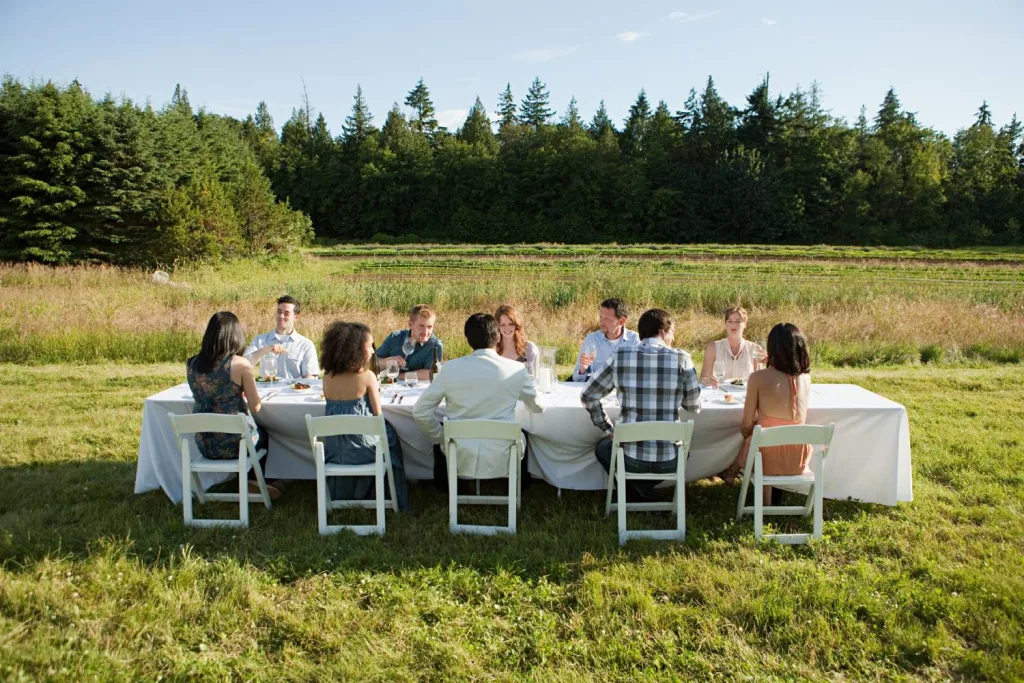 Group of tourists farm-to-table dining outdoors